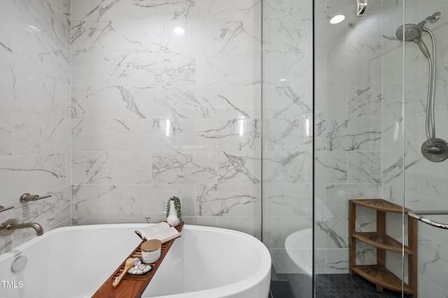 122 N Harrington St Unit 1025, Raleigh, NC 27603 - full bath featuring tile walls, a freestanding bath, and walk in shower