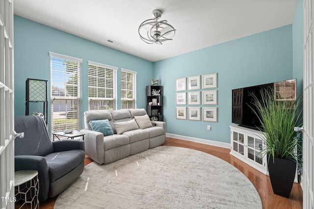 621 Aylestone Dr, Cary, NC 27519 - living room with wood finished floors and a chandelier
