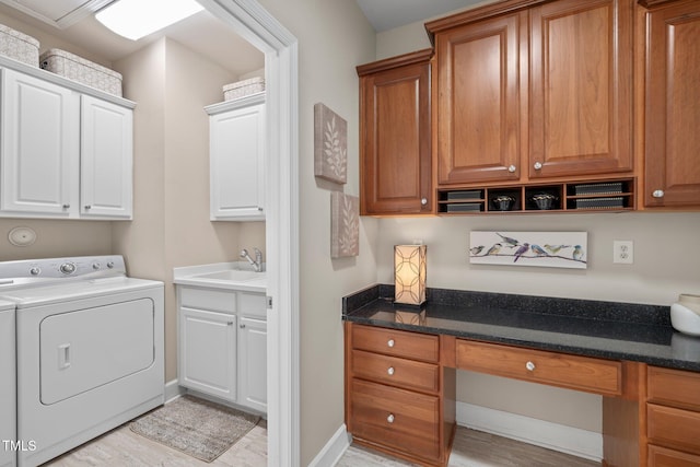 621 Aylestone Dr, Cary, NC 27519 - washroom with washer / clothes dryer, cabinet space, an office area, and light wood finished floors