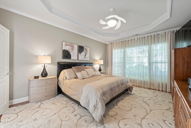 621 Aylestone Dr, Cary, NC 27519 - bedroom featuring ornamental molding, a raised ceiling, and ceiling fan