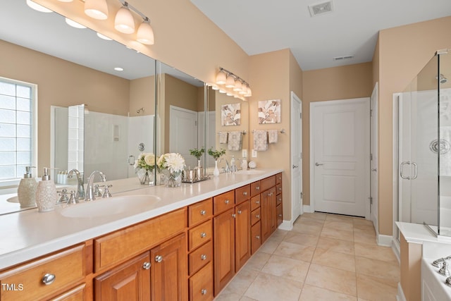 621 Aylestone Dr, Cary, NC 27519 - full bathroom featuring a stall shower, double vanity, and tile patterned flooring