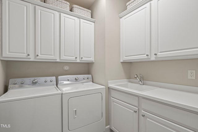 621 Aylestone Dr, Cary, NC 27519 - laundry room featuring cabinet space and washing machine and clothes dryer