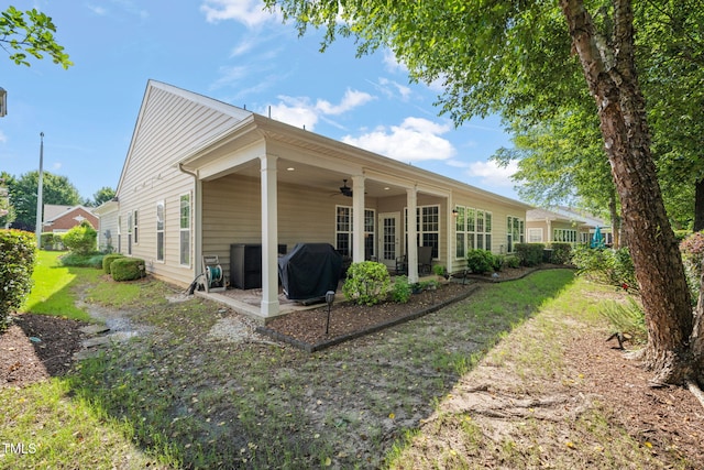 621 Aylestone Dr, Cary, NC 27519 - rear view of house featuring a ceiling fan and a patio
