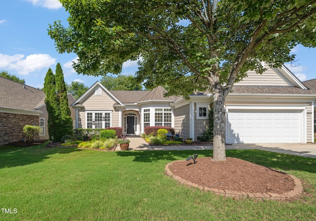 621 Aylestone Dr, Cary, NC 27519 - view of front of home featuring a front yard, concrete driveway, and a garage