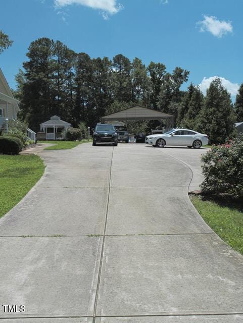 2817 Buckboard Ln, Raleigh, NC 27603 - view of car parking featuring driveway, a gazebo, and a carport