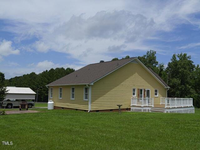 2817 Buckboard Ln, Raleigh, NC 27603 - back of property featuring crawl space, a yard, and a wooden deck
