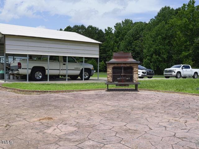 2817 Buckboard Ln, Raleigh, NC 27603 - view of parking / parking lot with a carport