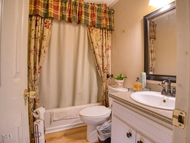 2817 Buckboard Ln, Raleigh, NC 27603 - full bath with vanity, shower / tub combo, and wood finished floors