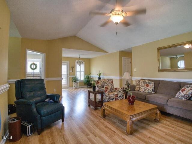 2817 Buckboard Ln, Raleigh, NC 27603 - living room featuring light wood-type flooring, a ceiling fan, and lofted ceiling