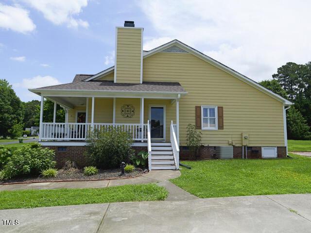 2817 Buckboard Ln, Raleigh, NC 27603 - view of front of property with crawl space, a porch, and a front yard