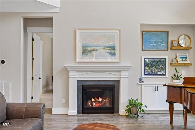 1809 Bowling Rd, Fuquay Varina, NC 27526 - living room with wood finished floors and a glass covered fireplace