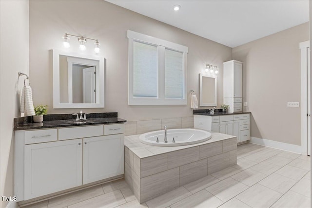 1809 Bowling Rd, Fuquay Varina, NC 27526 - full bath with two vanities, a bath, and recessed lighting