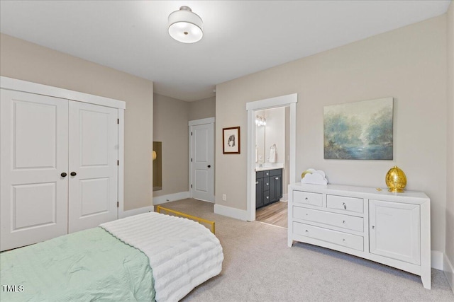 1809 Bowling Rd, Fuquay Varina, NC 27526 - bedroom featuring light carpet, a closet, and ensuite bathroom