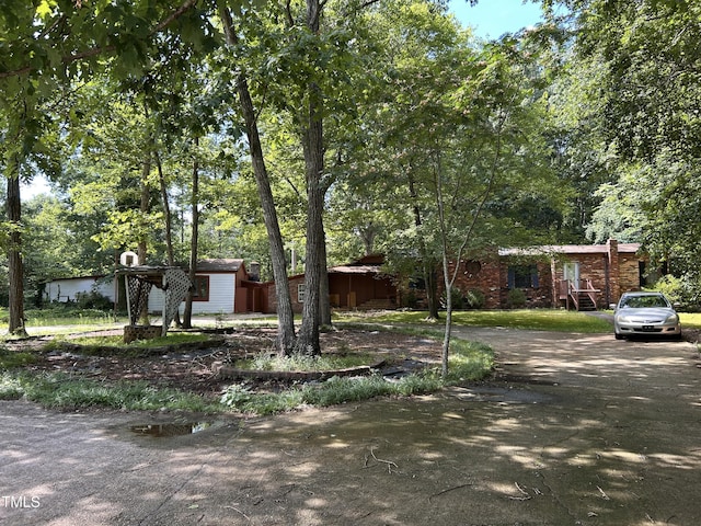 194 John Mitchell Rd, Youngsville, NC 27596 - view of front of property with a storage unit