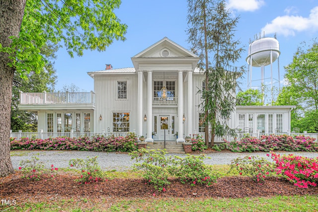 7920 E Washington St, Mebane, NC 27302 - neoclassical / greek revival house with a balcony, board and batten siding, a chimney, a metal roof, and french doors