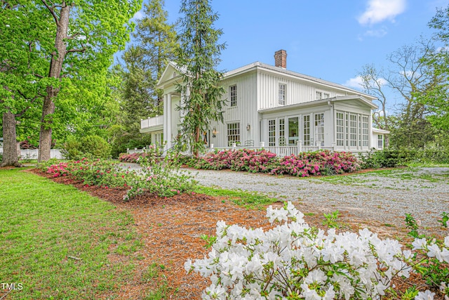 7920 E Washington St, Mebane, NC 27302 - view of property exterior featuring a sunroom and a chimney