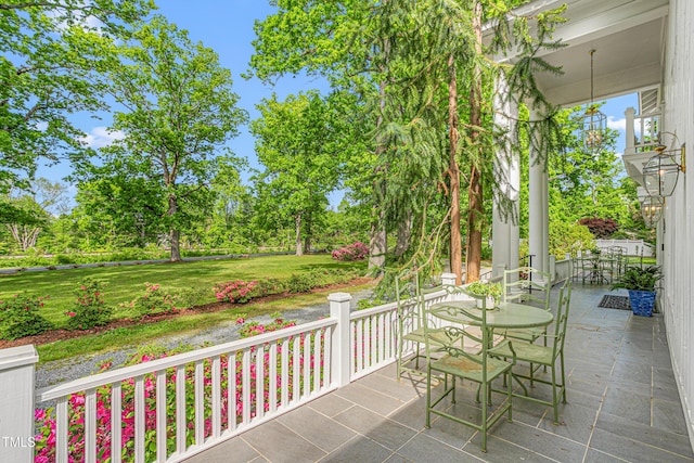 7920 E Washington St, Mebane, NC 27302 - covered porch with a yard and view of scattered trees