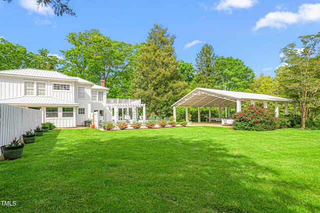 7920 E Washington St, Mebane, NC 27302 - view of yard featuring a detached carport, a pergola, and a patio area