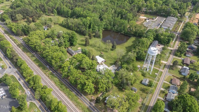 7920 E Washington St, Mebane, NC 27302 - aerial view of property's location featuring a large body of water and a heavily wooded area