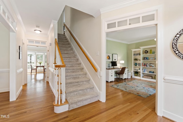 4309 Omni Pl, Raleigh, NC 27613 - stairs with wood finished floors and crown molding