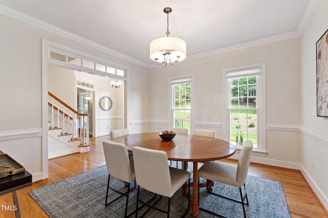4309 Omni Pl, Raleigh, NC 27613 - dining area featuring a chandelier, stairs, ornamental molding, and light wood-type flooring