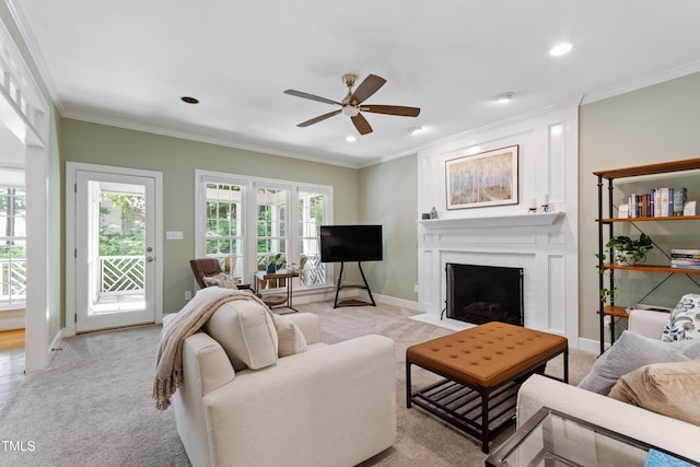 4309 Omni Pl, Raleigh, NC 27613 - living area featuring light colored carpet, ceiling fan, a large fireplace, plenty of natural light, and recessed lighting