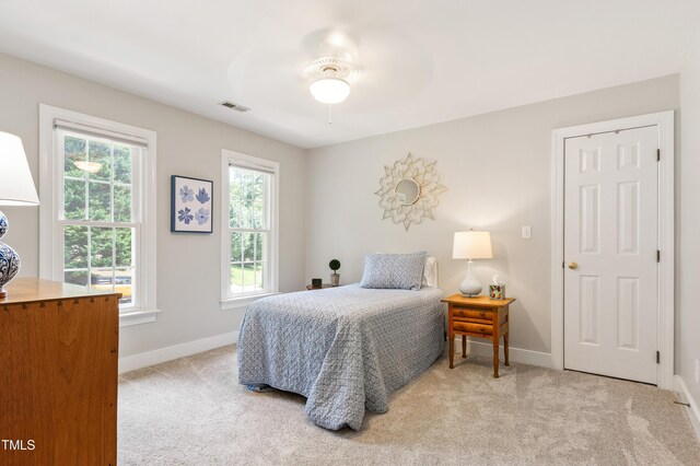 4309 Omni Pl, Raleigh, NC 27613 - bedroom featuring light colored carpet and a ceiling fan