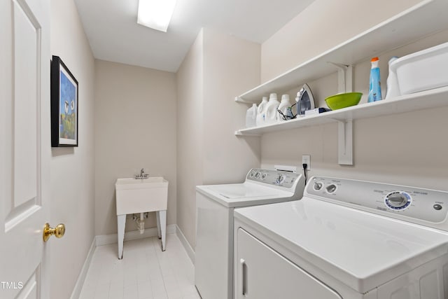 4309 Omni Pl, Raleigh, NC 27613 - laundry room featuring washer and clothes dryer and light tile patterned flooring