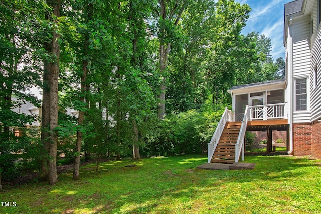 4309 Omni Pl, Raleigh, NC 27613 - view of green lawn featuring stairs, a sunroom, and a deck
