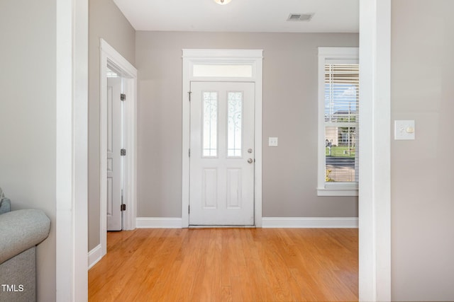 605 Bellefont Ct, Knightdale, NC 27545 - foyer entrance with baseboards and light wood-style flooring