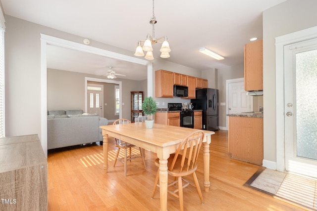 605 Bellefont Ct, Knightdale, NC 27545 - dining room with a chandelier, light wood-type flooring, and a ceiling fan