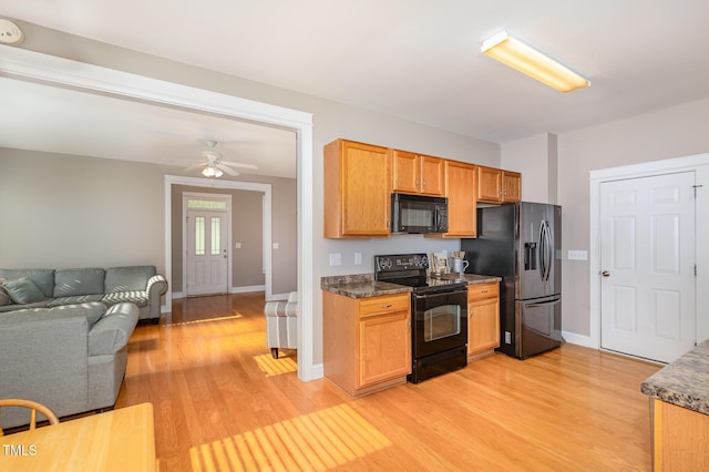 605 Bellefont Ct, Knightdale, NC 27545 - kitchen with black appliances, light wood finished floors, open floor plan, and ceiling fan