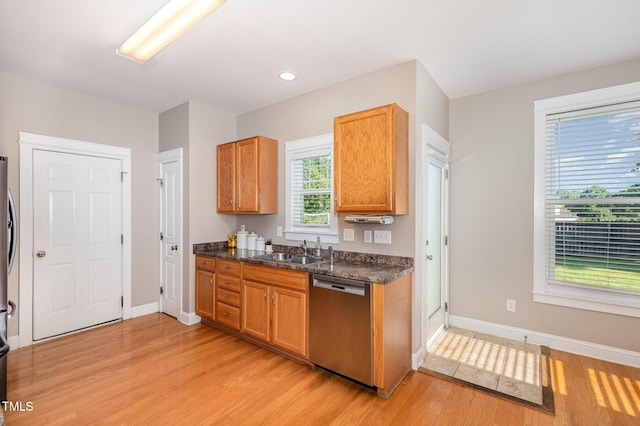 605 Bellefont Ct, Knightdale, NC 27545 - kitchen featuring stainless steel dishwasher, light wood finished floors, recessed lighting, dark stone countertops, and brown cabinetry