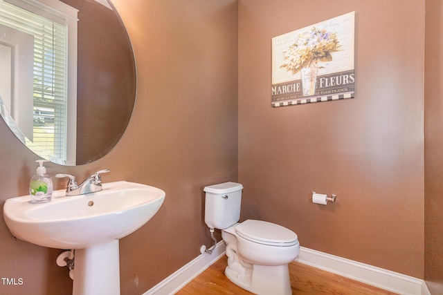 605 Bellefont Ct, Knightdale, NC 27545 - half bathroom featuring baseboards and wood finished floors