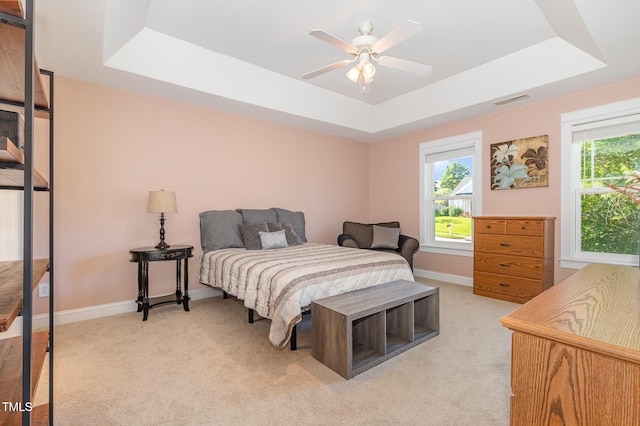 605 Bellefont Ct, Knightdale, NC 27545 - bedroom with a raised ceiling, multiple windows, and light carpet