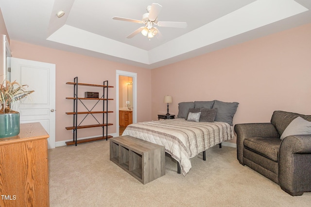 605 Bellefont Ct, Knightdale, NC 27545 - bedroom with light colored carpet, a tray ceiling, connected bathroom, and ceiling fan