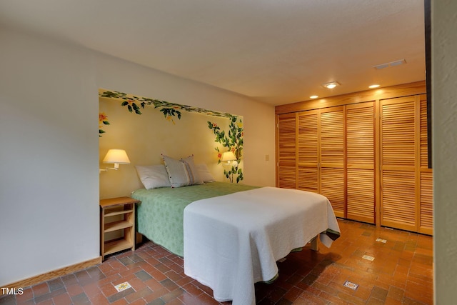 1320 Shepherd St, Durham, NC 27707 - bedroom with recessed lighting, brick flooring, and a closet