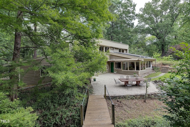 1320 Shepherd St, Durham, NC 27707 - back of property featuring a patio area and a sunroom