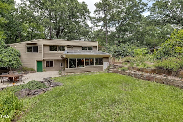 1320 Shepherd St, Durham, NC 27707 - back of house featuring a patio area, a lawn, and view of wooded area