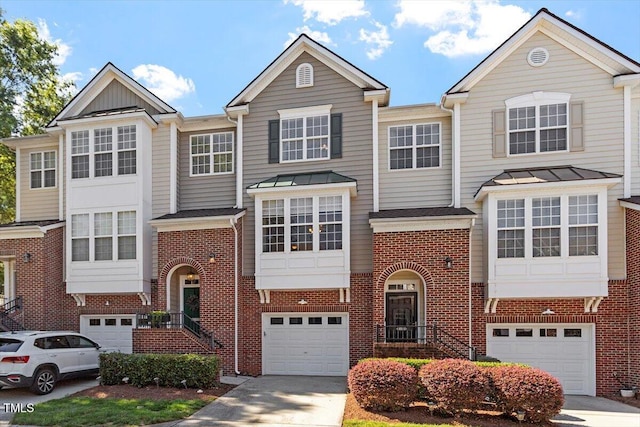 4533 Pale Moss Dr, Raleigh, NC 27606 - multi unit property with an attached garage, driveway, and brick siding