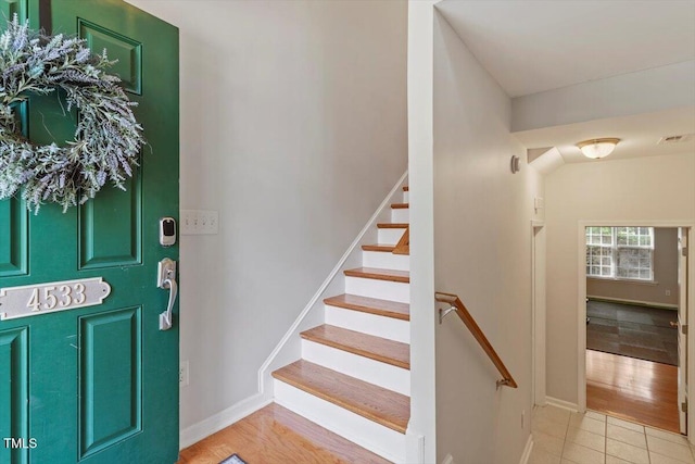 4533 Pale Moss Dr, Raleigh, NC 27606 - foyer featuring stairway and tile patterned flooring