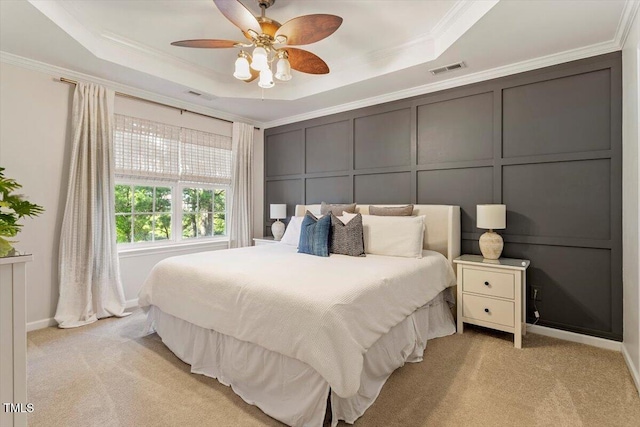 4533 Pale Moss Dr, Raleigh, NC 27606 - bedroom with a tray ceiling, a decorative wall, light carpet, crown molding, and a ceiling fan