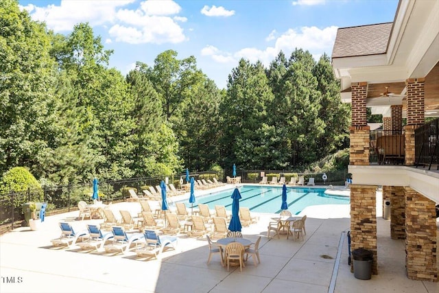 4533 Pale Moss Dr, Raleigh, NC 27606 - community pool with a patio and view of wooded area