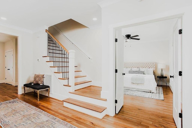 415 E Lavender Ave, Durham, NC 27704 - stairs with wood finished floors, a ceiling fan, recessed lighting, and ornamental molding