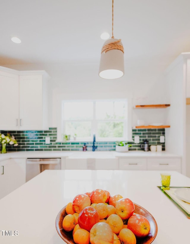 415 E Lavender Ave, Durham, NC 27704 - kitchen featuring white dishwasher, backsplash, light countertops, white cabinetry, and recessed lighting