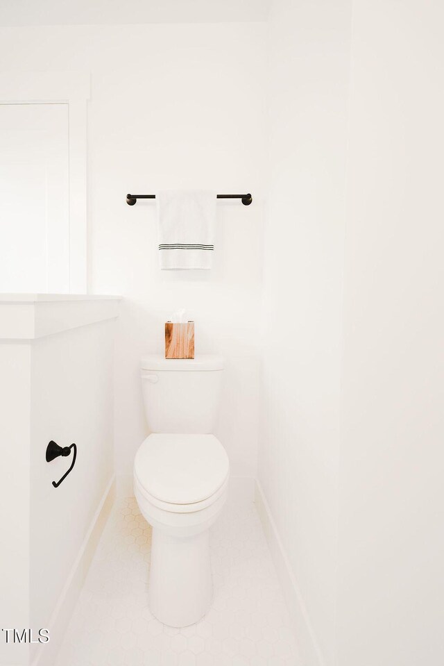 415 E Lavender Ave, Durham, NC 27704 - bathroom featuring baseboards and tile patterned floors