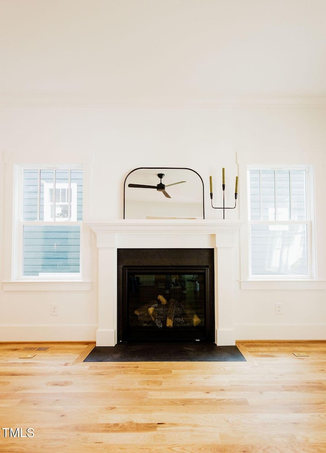 415 E Lavender Ave, Durham, NC 27704 - detailed view of crown molding, wood finished floors, and a fireplace with flush hearth