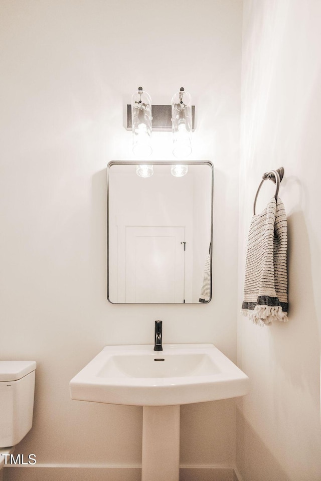 415 E Lavender Ave, Durham, NC 27704 - bathroom featuring toilet and a sink