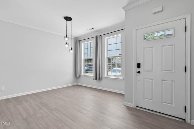 4536 Sugarbend Way, Raleigh, NC 27606 - foyer entrance featuring plenty of natural light, wood finished floors, and crown molding