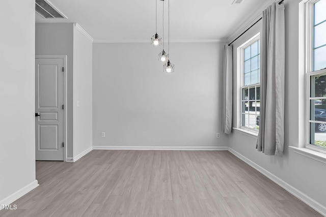 4536 Sugarbend Way, Raleigh, NC 27606 - unfurnished room with ornamental molding, light wood-type flooring, and healthy amount of natural light